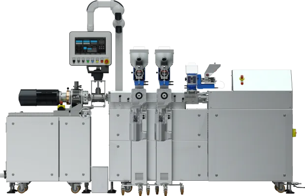 Wytłaczarka laboratoryjna LE-2CC 2x24 mm  z granulatorem przy głowicy oraz podajnikami bocznymi i grawimetrycznymi.